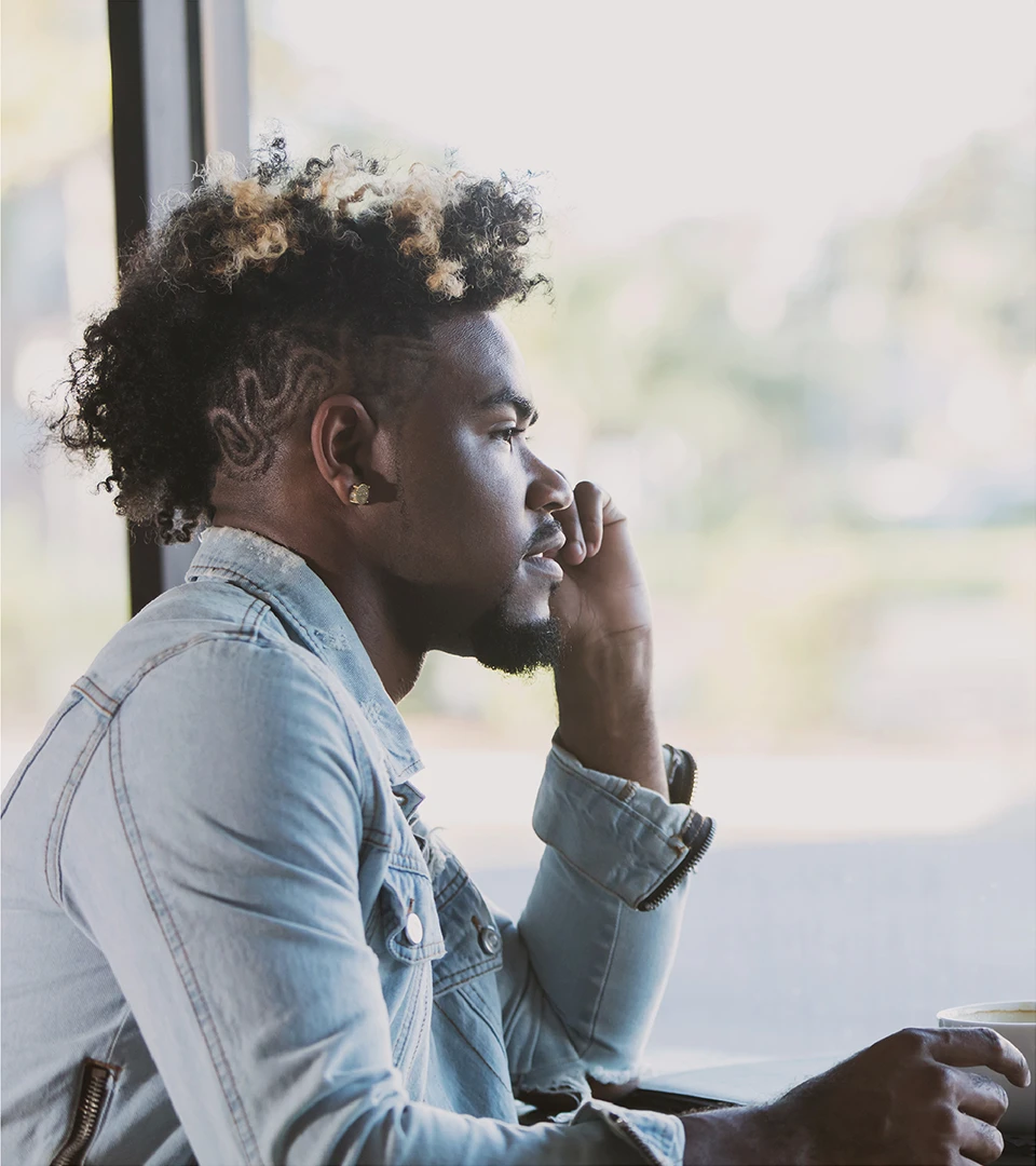 A man in quiet conversation on the phone