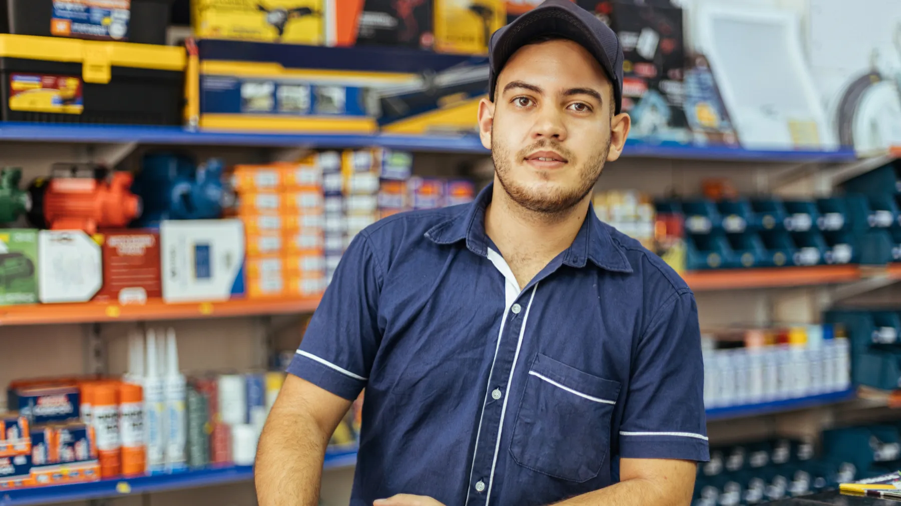 A hardware store worker behind the counter
