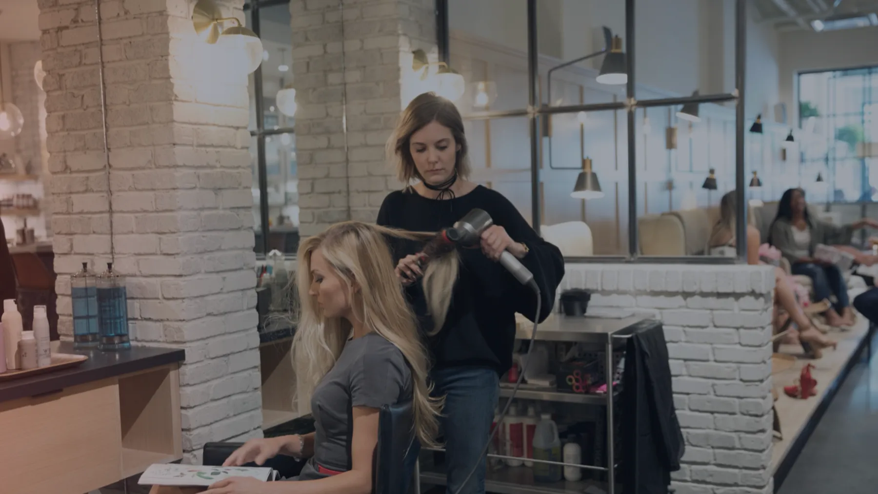 A stylist working with a client in a salon